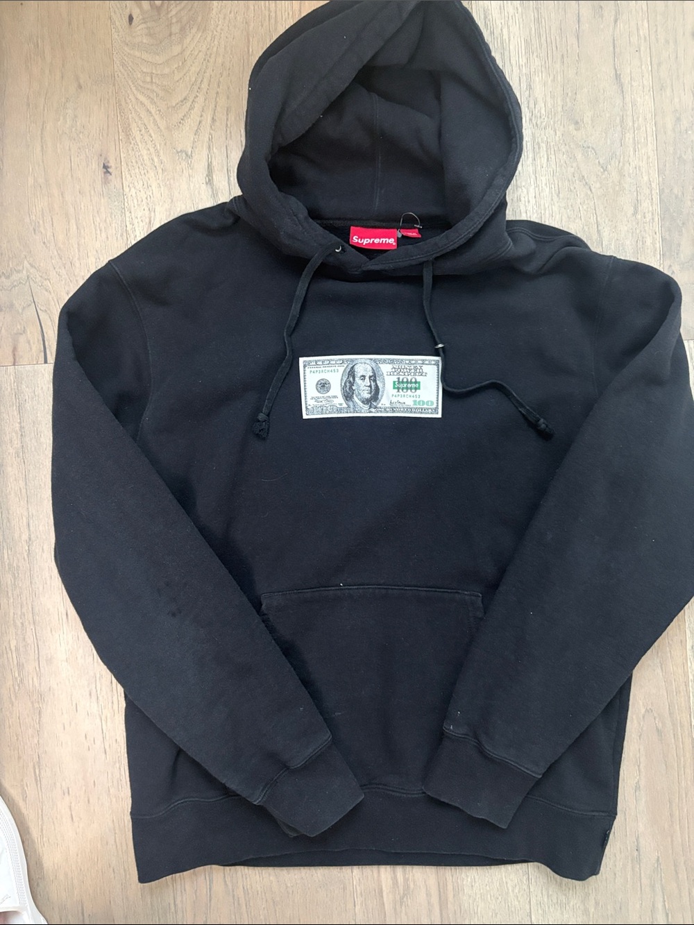 Supreme Black Hoodie with Dollar Bill Chest Graphic